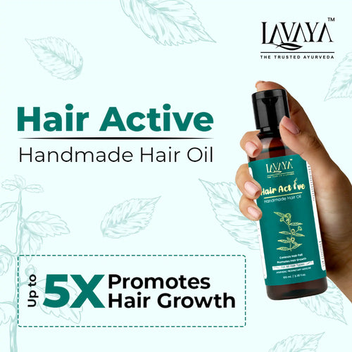 Lavaya Hair Active handmade hair oil bottle held by a hand with product details on a white background.