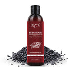 Lavaya Sesame Oil bottle with sesame seeds on a white background