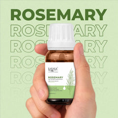 Hand holding a bottle of Lavera Rosemary essential oil against a green background with 'Rosemary' text.