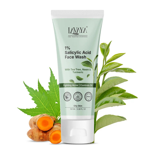 Lavaya 1% Salicylic Acid Face Wash tube with turmeric and tea tree leaves on a white background