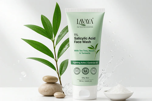 LAVAYA 1% salicylic acid face wash with tea tree oil, neem and turmeric for clear skin benefits - 100ml tube for oily skin showing acne fighting and oil control properties with fresh neem leaves, spa stones and water splash for natural Ayurvedic skincare