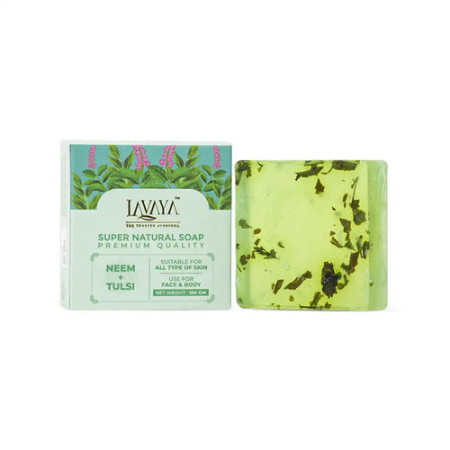 Lavaya Neem Tulsi soap bar with visible herbs next to its packaging on a white background